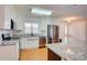 Bright kitchen with white cabinetry, granite countertops, and stainless appliances at 4205 Ore Bank Dr, Lincolnton, NC 28092