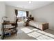 Bright bedroom features a work desk, bed with plaid bedding and natural light from the window at 421 Silver Cypress Ln, Fort Mill, SC 29708