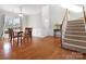 Bright dining area with hardwood floors and staircase at 421 Silver Cypress Ln, Fort Mill, SC 29708