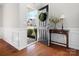 Entryway featuring hardwood floors, wainscoting, and an inviting open door at 421 Silver Cypress Ln, Fort Mill, SC 29708