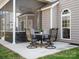 Covered patio with dining set, perfect for enjoying meals outside at 421 Silver Cypress Ln, Fort Mill, SC 29708