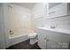 Bathroom featuring a shower-tub combo, hexagon tile floor, modern vanity and a white subway tile backsplash at 4910 Lailwood Cir, Charlotte, NC 28227