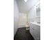 Well-lit bathroom with white subway tile, a modern vanity, and a sleek, tiled floor at 4910 Lailwood Cir, Charlotte, NC 28227