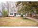 Charming one story home with mature trees and a green lawn at 4910 Lailwood Cir, Charlotte, NC 28227