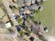 Overhead shot of the lake community showcasing waterfront properties and boat docks at 604 Fairway Shores Rd, Mount Gilead, NC 27306