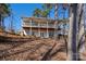 Multi-level deck and backyard of home landscaped with terraces at 604 Fairway Shores Rd, Mount Gilead, NC 27306