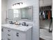 Bathroom featuring marble countertops, double sinks, and modern lighting fixtures at 604 Fairway Shores Rd, Mount Gilead, NC 27306