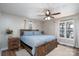 Cozy bedroom featuring a wood bed frame and a ceiling fan for added comfort at 604 Fairway Shores Rd, Mount Gilead, NC 27306