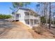 Two-story home with an inviting deck offers scenic views and outdoor living spaces for relaxation at 604 Fairway Shores Rd, Mount Gilead, NC 27306