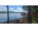 Beautiful water view of a boat house dock from the shore at 604 Fairway Shores Rd, Mount Gilead, NC 27306