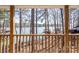 Breathtaking view from the deck overlooking the tranquil lake, framed by lush trees creating a peaceful retreat at 604 Fairway Shores Rd, Mount Gilead, NC 27306