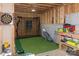 Unfinished basement with golf simulator, with ample potential for customization and recreation at 615 R L Stowe Rd, Belmont, NC 28012