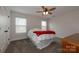 Bedroom with a ceiling fan, carpet, and a comfortable bed at 615 R L Stowe Rd, Belmont, NC 28012