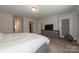 Bright bedroom featuring carpet floors, a dresser, and a TV at 615 R L Stowe Rd, Belmont, NC 28012