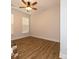 Bright bedroom featuring hardwood floors, ceiling fan, and neutral walls at 615 R L Stowe Rd, Belmont, NC 28012