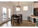 Eat-in kitchen featuring a table and chairs near the stainless steel refrigerator at 615 R L Stowe Rd, Belmont, NC 28012