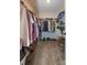 Spacious walk-in closet featuring ample storage with shelves and rods for organizing clothes and shoes at 615 R L Stowe Rd, Belmont, NC 28012