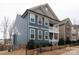 Stylish two-story home with a side porch, showcasing contemporary design and curb appeal at 615 R L Stowe Rd, Belmont, NC 28012