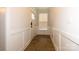 Inviting hallway with a paneled wall, front door, and wood-look flooring at 615 R L Stowe Rd, Belmont, NC 28012