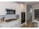 Kitchen with stainless steel appliances and white cabinets for modern cooking at 615 R L Stowe Rd, Belmont, NC 28012