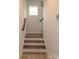 Wooden stairway with white risers and matching handrails for a stylish design at 615 R L Stowe Rd, Belmont, NC 28012