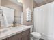 Bathroom features a single sink vanity, shower with curtain, and stacked towel rack at 620 Briar Patch Ter, Waxhaw, NC 28173