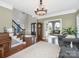 Grand foyer with high ceilings, hardwood floors, and an elegant staircase, showcasing a welcoming atmosphere at 620 Briar Patch Ter, Waxhaw, NC 28173