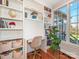 Cozy home office with built-in bookshelves, a modern desk, natural light, and stylish decor elements at 620 Briar Patch Ter, Waxhaw, NC 28173