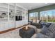 Comfortable living room with built-in bookshelves and cabinets, neutral paint, and recessed lighting at 620 Briar Patch Ter, Waxhaw, NC 28173