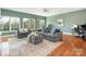 Spacious living room with large windows and comfortable seating area at 620 Briar Patch Ter, Waxhaw, NC 28173