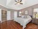 Spacious main bedroom with hardwood floors, a tray ceiling and recessed lighting at 620 Briar Patch Ter, Waxhaw, NC 28173