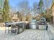 Spacious outdoor kitchen featuring stone countertops, stainless steel grill, pizza oven, and refrigerator at 620 Briar Patch Ter, Waxhaw, NC 28173