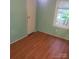 The bedroom offers neutral paint and natural light from a window at 6271 Sherwood Ln, Denver, NC 28037