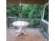 Outdoor deck features an outdoor table and scenic wooded backyard views at 6271 Sherwood Ln, Denver, NC 28037