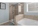 Bathroom featuring glass shower and soaker tub offering a spa-like experience at 649 Shellbark Dr, Concord, NC 28025