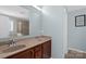 Bathroom featuring double sinks and a large mirror, offering convenience and style at 649 Shellbark Dr, Concord, NC 28025