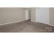 Bedroom features carpeted floors and closet storage at 649 Shellbark Dr, Concord, NC 28025