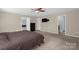 Comfortable bedroom with ceiling fan and TV, providing relaxation and entertainment at 649 Shellbark Dr, Concord, NC 28025