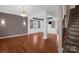 Bright and airy living room with hardwood floors, decorative columns, and an open floor plan at 649 Shellbark Dr, Concord, NC 28025