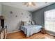 A bedroom featuring a daybed with decorations on the wall at 7918 Travers Run Dr, Charlotte, NC 28215