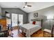 A bedroom featuring a bed, vaulted ceiling, and large windows for natural light at 7918 Travers Run Dr, Charlotte, NC 28215