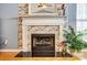 Beautiful fireplace featuring brick surround, classic mantel, and an elegant mirror above at 7918 Travers Run Dr, Charlotte, NC 28215