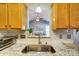 Kitchen sink boasts granite countertops and a view into the home's beautiful living room at 7918 Travers Run Dr, Charlotte, NC 28215