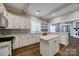 Well-equipped kitchen with white cabinets, stainless appliances, and hardwood flooring at 801 Sandifer Rd, York, SC 29745