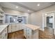 Eat-in kitchen featuring stainless steel appliances, white cabinets and seamless flow to the living room at 801 Sandifer Rd, York, SC 29745