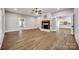 Open-concept living area featuring hardwood floors and fireplace at 801 Sandifer Rd, York, SC 29745