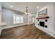 Open-concept living room with fireplace, hardwood floors and plenty of natural light at 801 Sandifer Rd, York, SC 29745