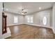 Spacious living area with hardwood floors, fireplace and decorative front door at 801 Sandifer Rd, York, SC 29745