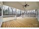 Covered porch with natural wood flooring and a view of trees at 801 Sandifer Rd, York, SC 29745