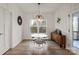 Bright dining area with sleek white table, modern chairs, hardwood floors, and stylish light fixture at 820 Bellegray Rd, Clover, SC 29710